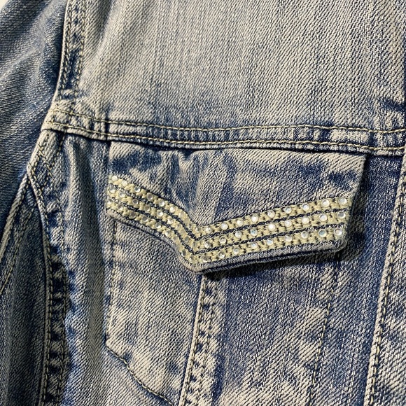 Chico’s Platinum Ruffled Jean jacket with rhinestone pockets and buttons.Size 8 - Picture 3 of 12